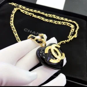 Affordable jewelry NYC black heart pendant necklace with gold chain and logo charm