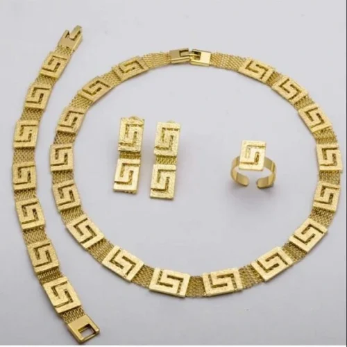 Jewelry store NYC gold necklace, bracelet, earrings, and ring set with geometric design
